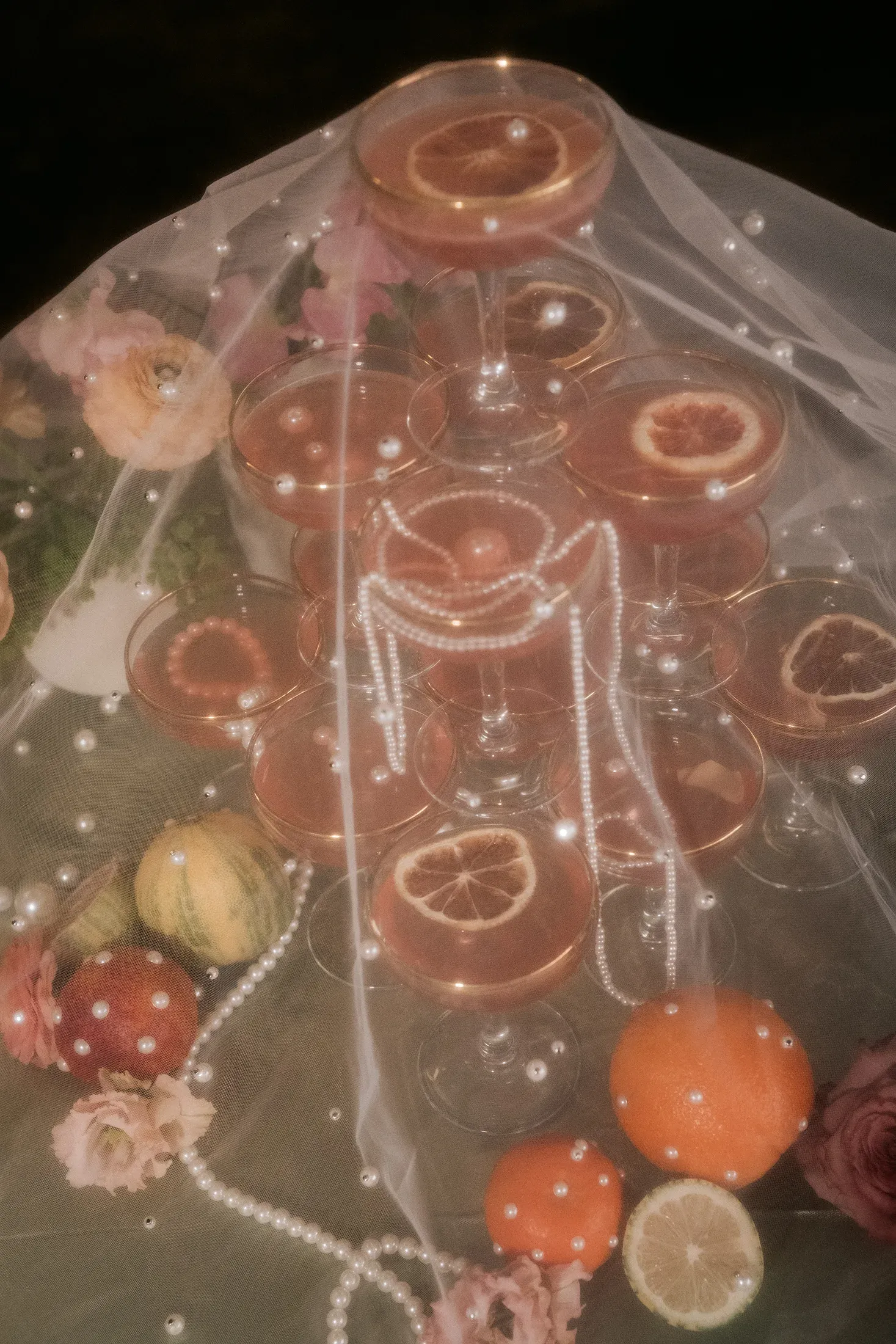 Champagne and pearl details beneath a wedding veil