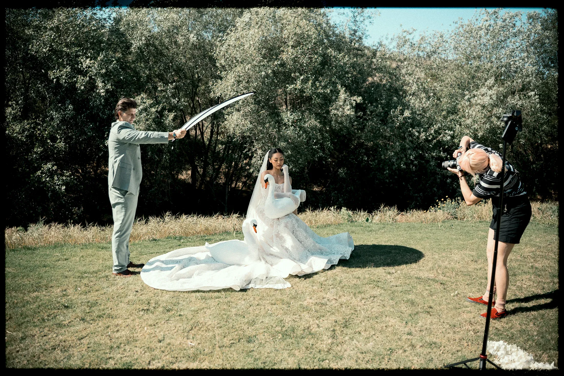 Jane and Kolya working together at an outdoor wedding